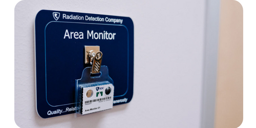 Area monitor dosimetry badge