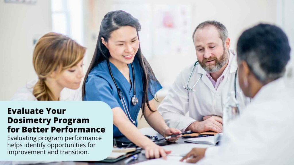 A hospital team evaluates dosimetry program performance during a meeting.